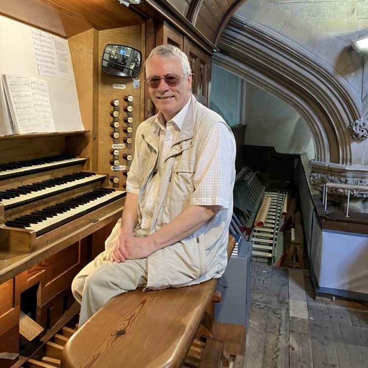 [Julian - Director of Music and Organist]