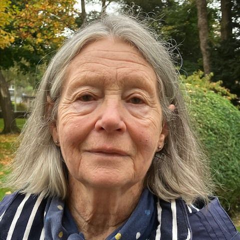 [Photo of Hilary Corbett]